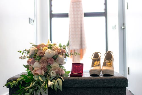 White and Pink Roses Bouquet on the Couch