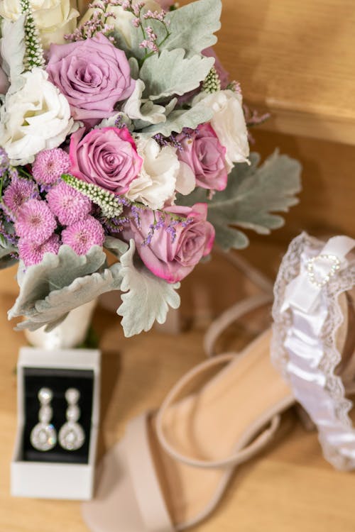 Free Bridal Bouquet of Flowers, Earrings, a Shoe and a Garter Stock Photo