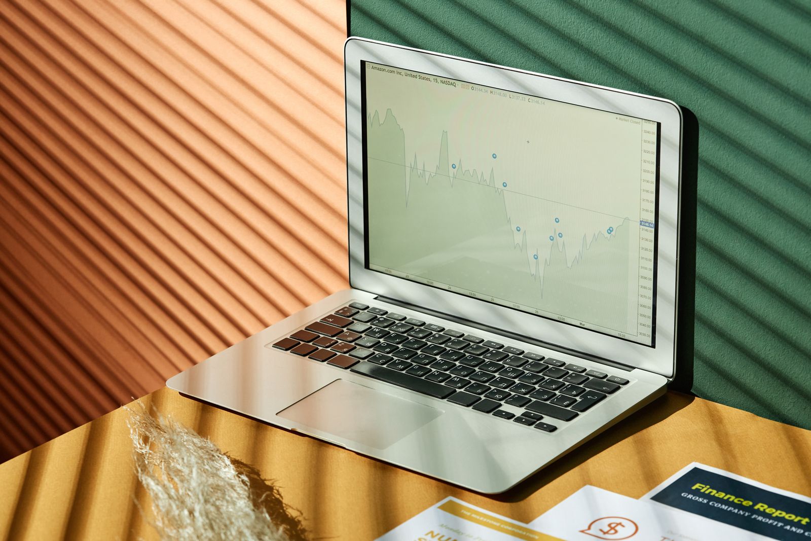 Laptop displaying analytics in a sunlit workspace