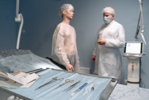 Free Doctor and Patient Talking in the Operating Room Stock Photo