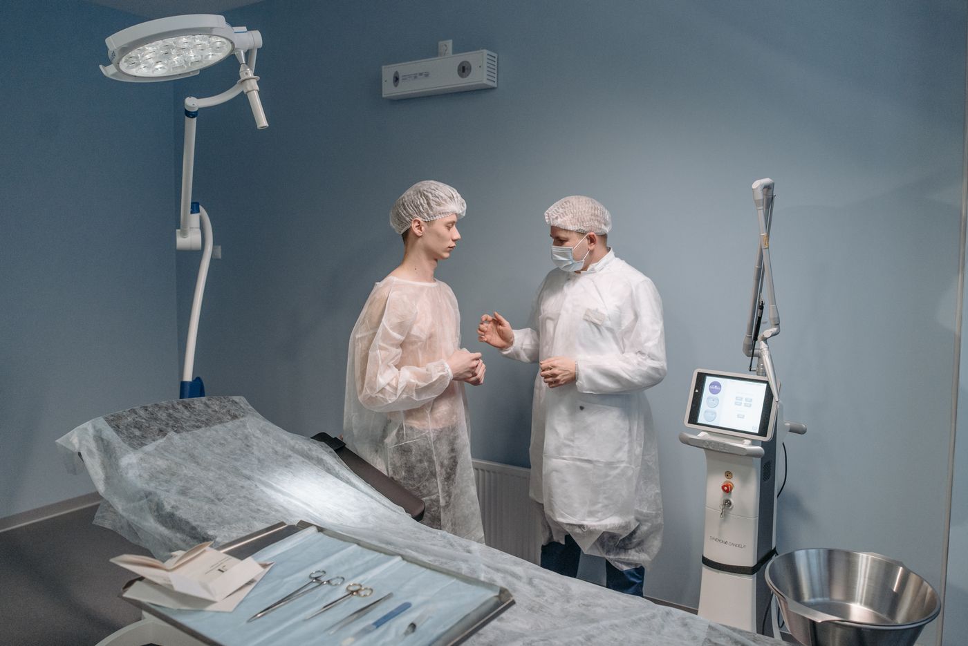 Doctor and patient in a medical consultation at a clinic with surgical equipment. — illustrative stock photograph