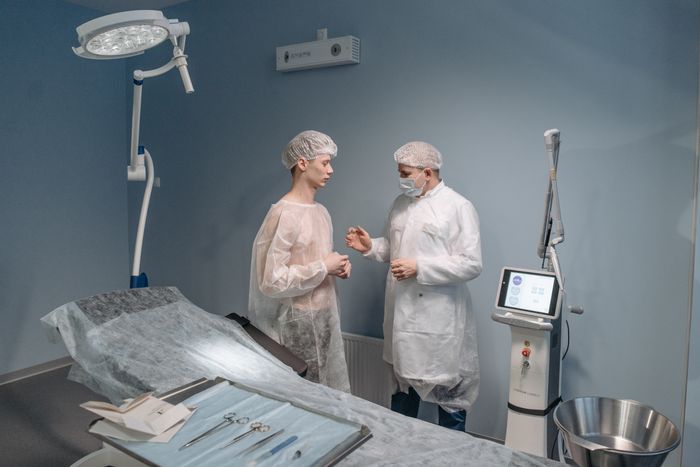 Doctor and patient discussing a surgical procedure during a clinical consultation