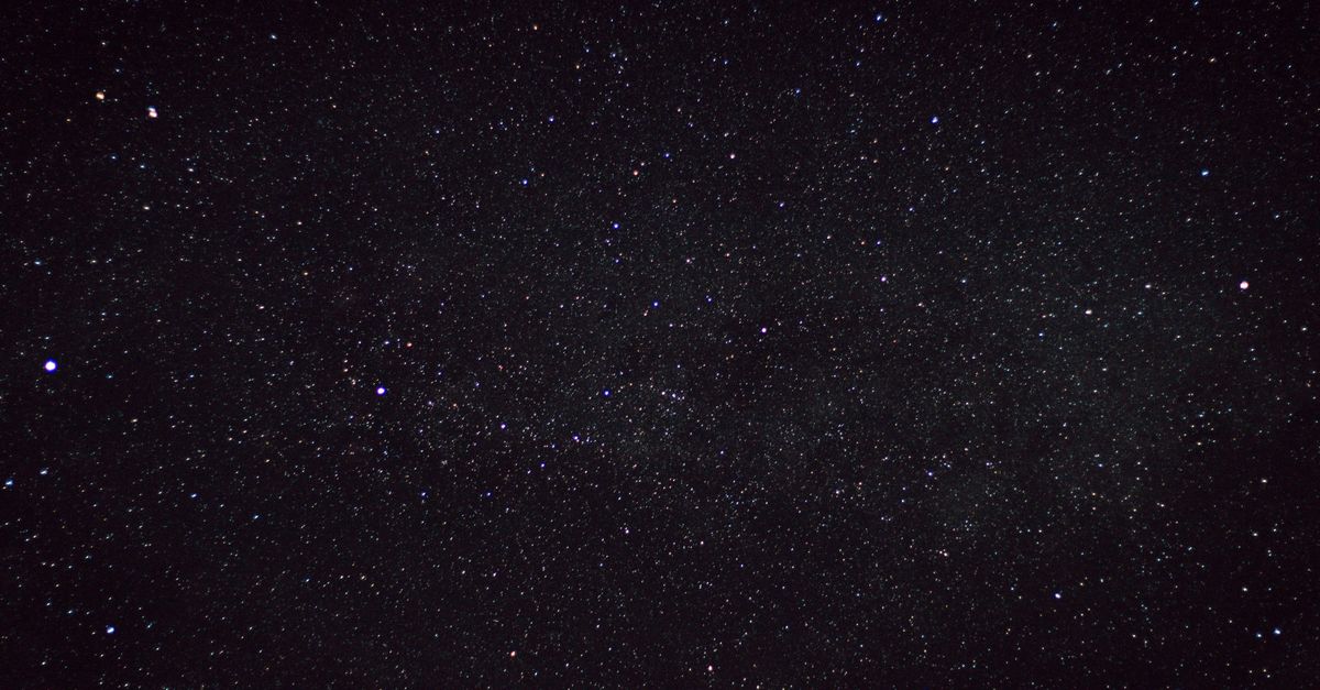 A clear starry night sky captured over the countryside in Germany, showcasing countless stars.