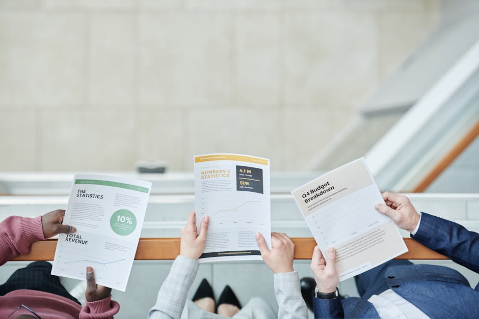 An investor meeting with a loan officer, reviewing documents. - property acquisition loan An investor meeting with a loan officer, reviewing documents. - property acquisition loan