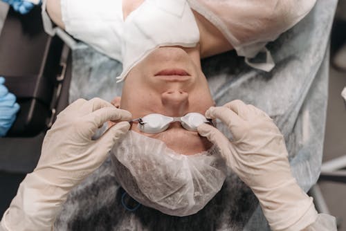 Free Woman Lying Being Prepared for Operation Stock Photo