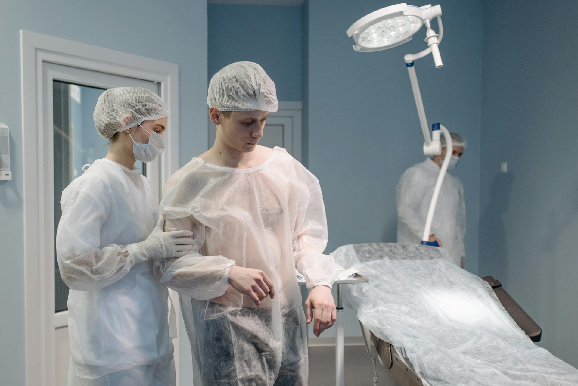 Nurse Helping Patient in Operating Room