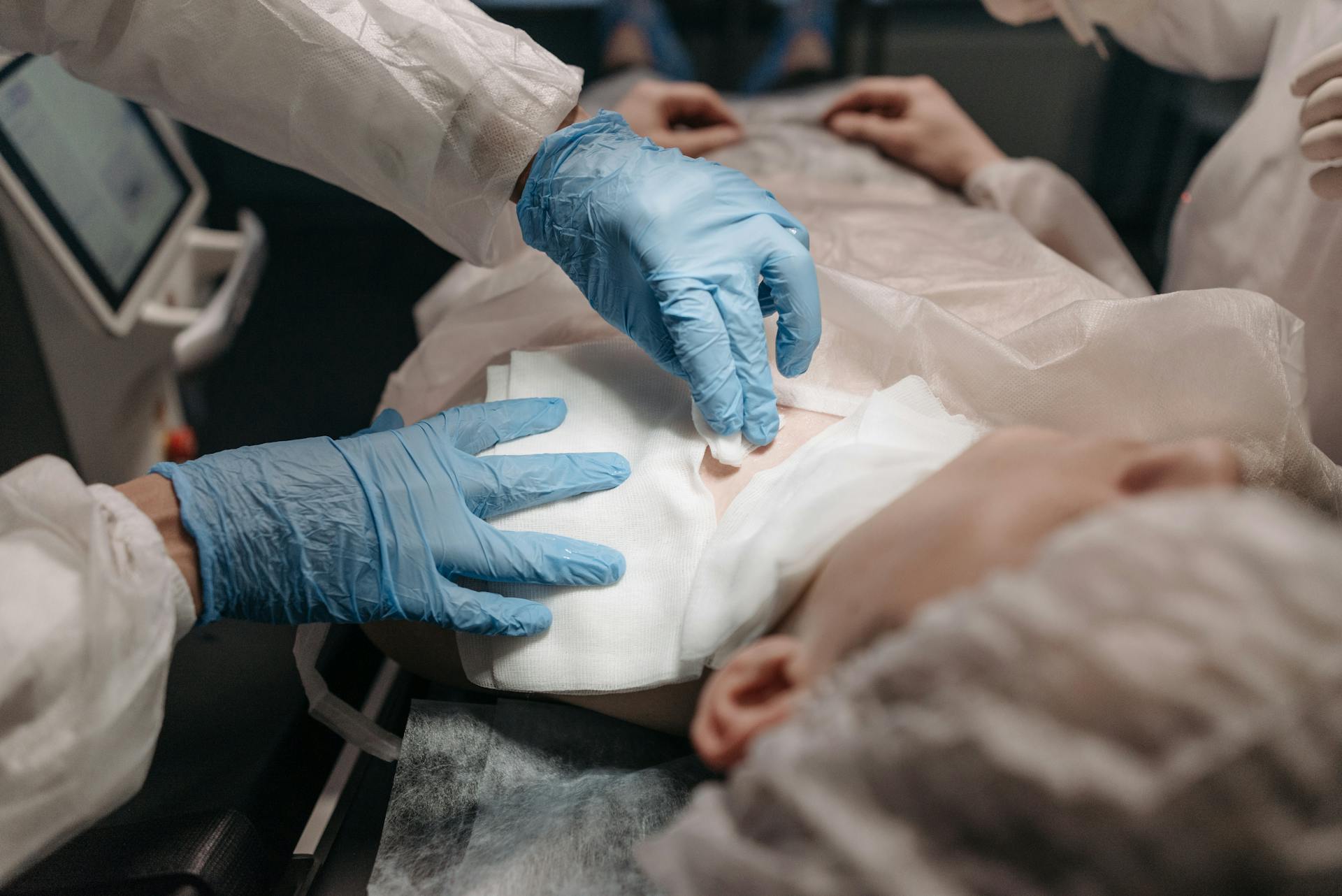 Person Doing an Operating Procedure on a Patient