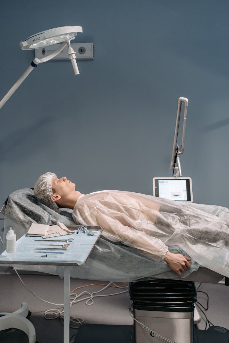 A Patient Lying Down On An Operating Table