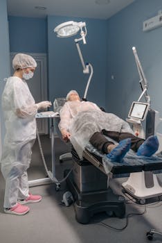 Healthcare professional assists patient before procedure in modern medical facility.