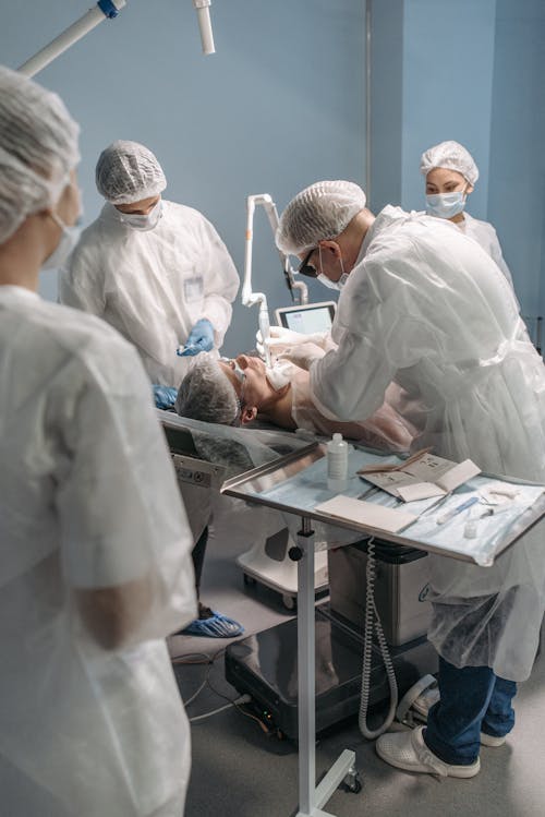 Free A Medical Professional Doing an Operation  Stock Photo
