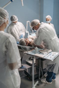 Doctors and nurses conducting a surgical procedure in a hospital operating room.