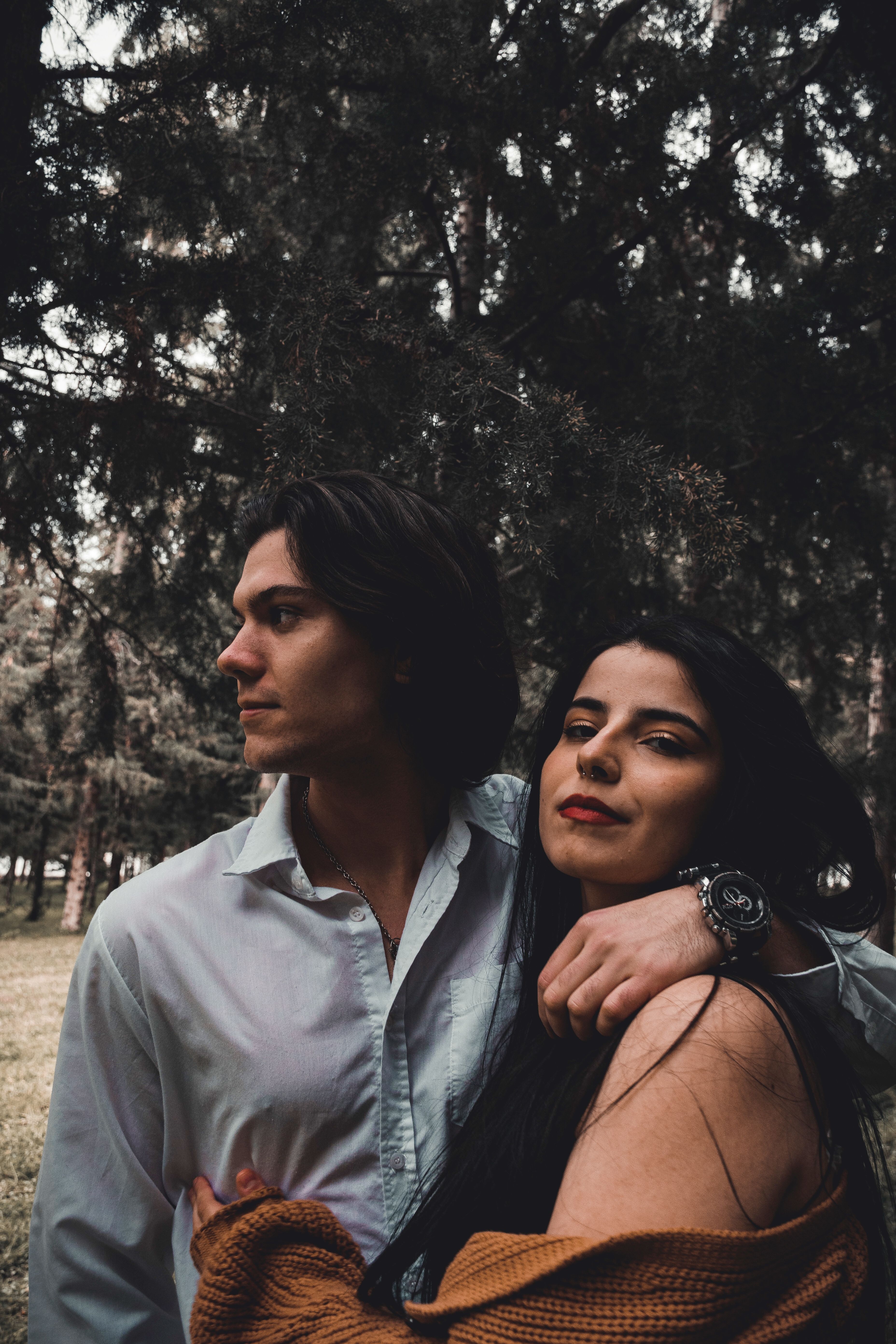 A Man with His Hand on a Woman's Shoulder · Free Stock Photo