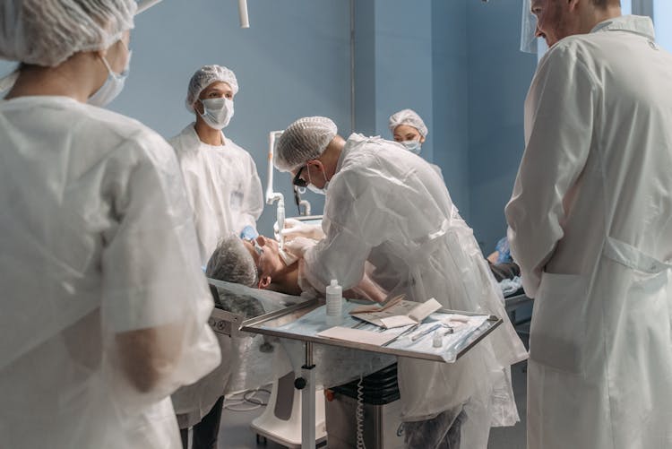 Doctor Performing An Operation On Patient