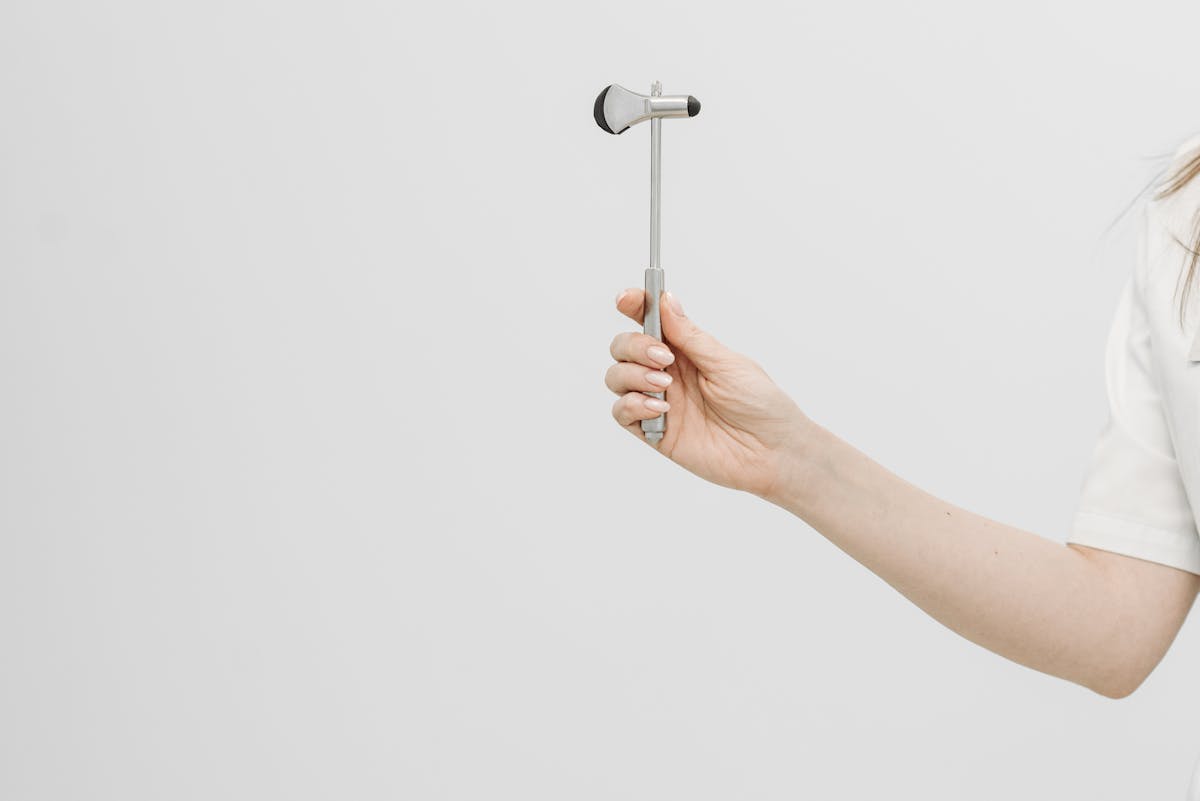Doctor Holding a Hammer