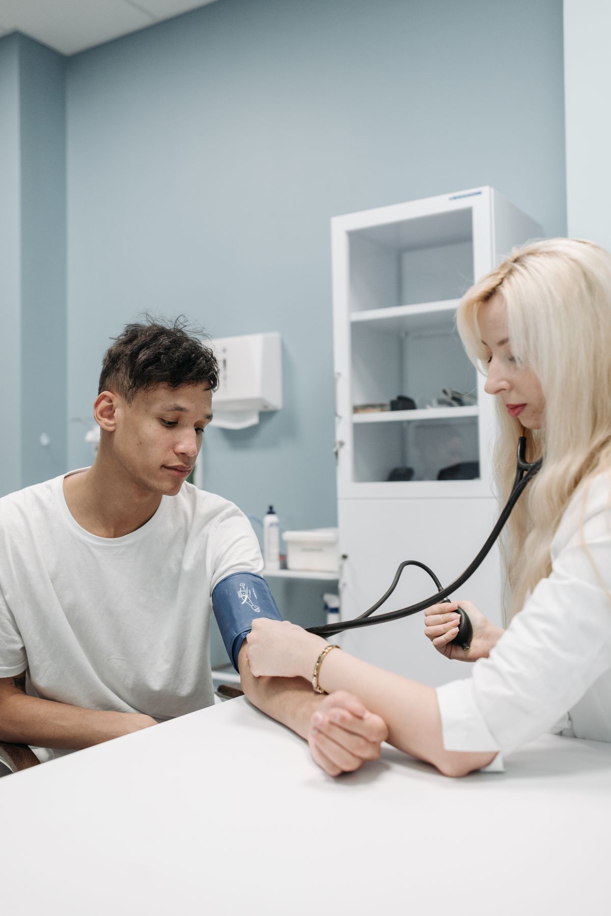 Doctor completing a routine preventive examination for an adult patient