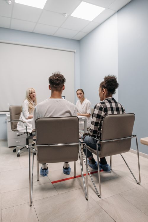 Free Group of people engaged in a meeting in a contemporary office space. Stock Photo