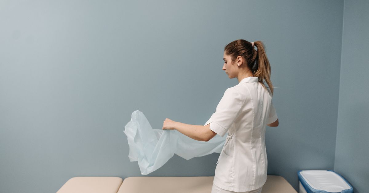 clean, modern hospital room with a view of a city skyline, a patient smiling