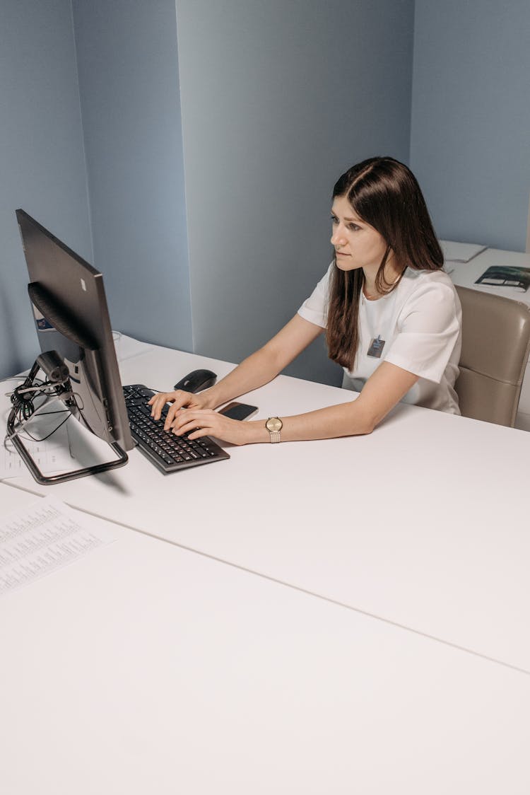 Woman Working On A Computer In A Hospital