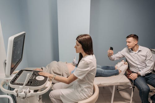 Free A Doctor Looking at an Ultrasound Stock Photo