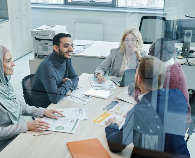 A business team discussing cybersecurity strategies in a conference room