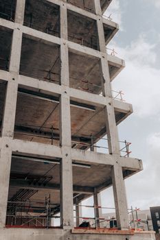 Low angle detail of semi built modern multistage building at construction site in city