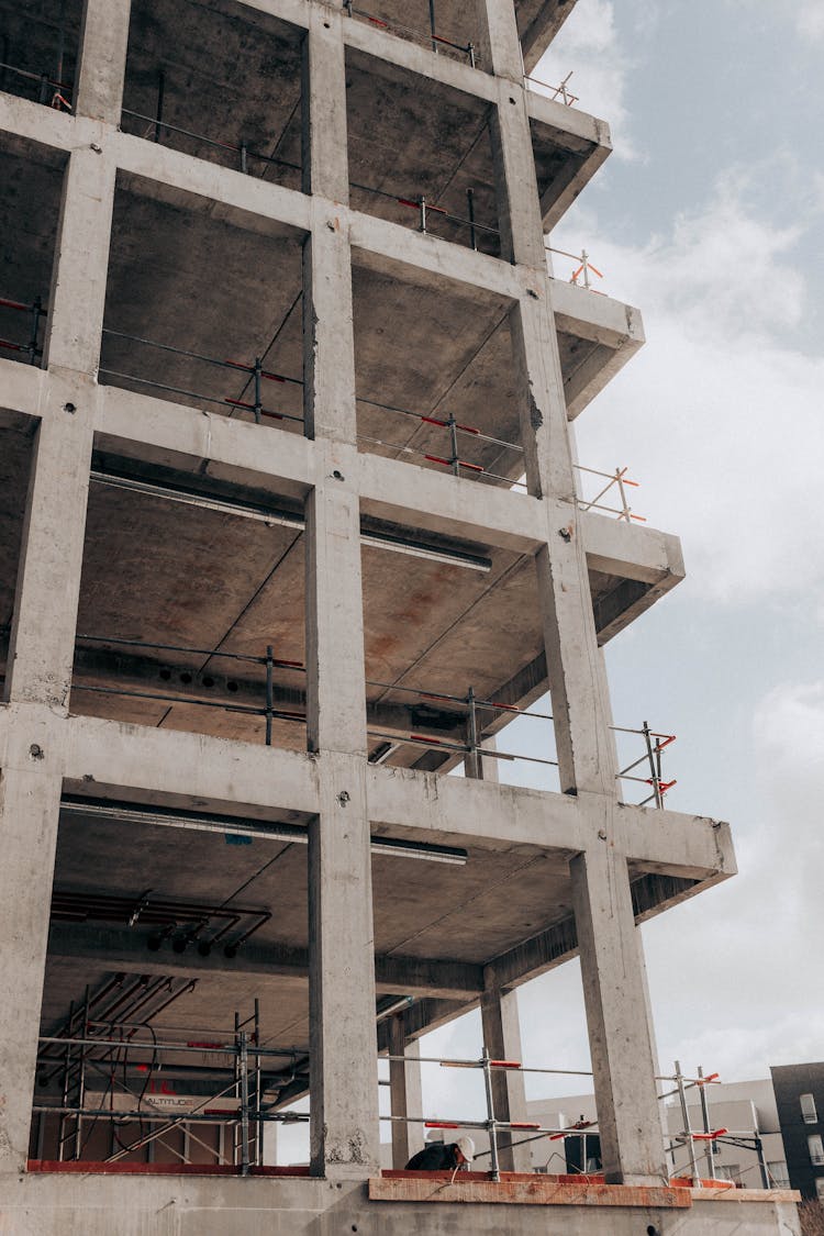 Facade Of Unfinished Concrete Building At Construction Site