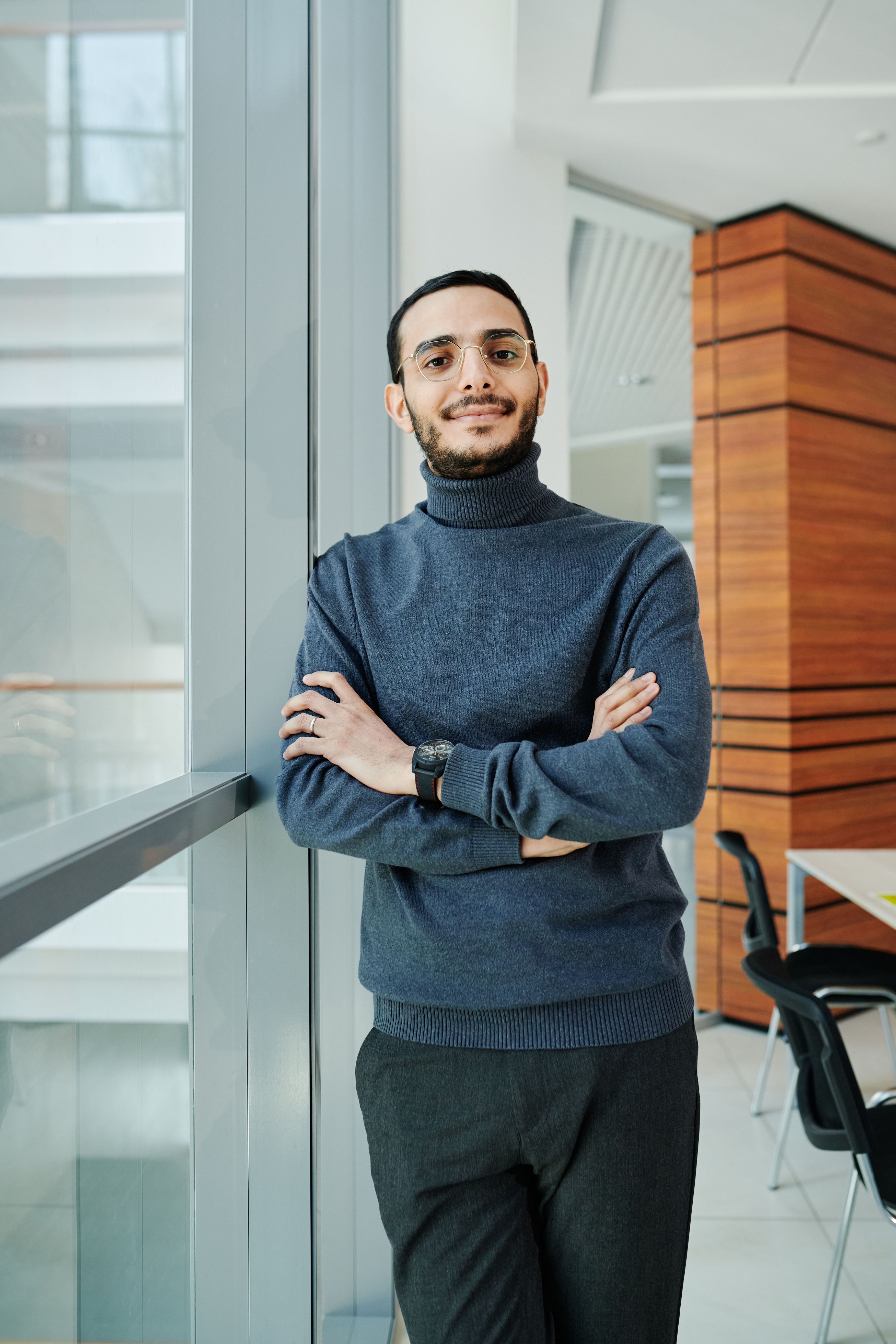 Man in Gray Turtleneck Sweater Standing Beside Glass Window · Free ...