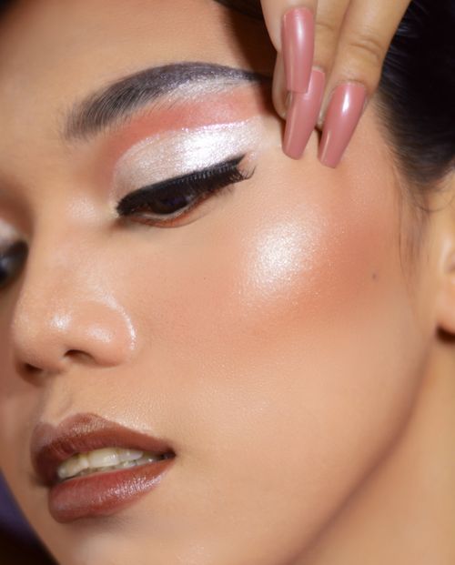 Free Stunning close-up photo showcasing skilled eye makeup and elegant nails, capturing a sense of modern beauty. Stock Photo