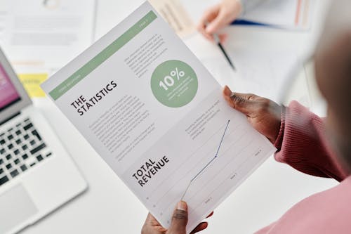Free A Person Holding a Business Report Stock Photo