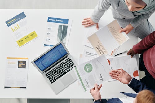 Free People in the Meeting Holding Documents Stock Photo