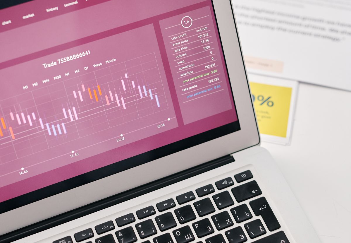 Laptop showing operational reports and performance graphs