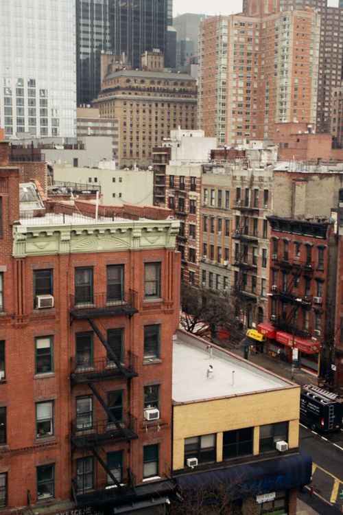 Free Aerial view of diverse architecture in a bustling urban cityscape featuring historic buildings. Stock Photo