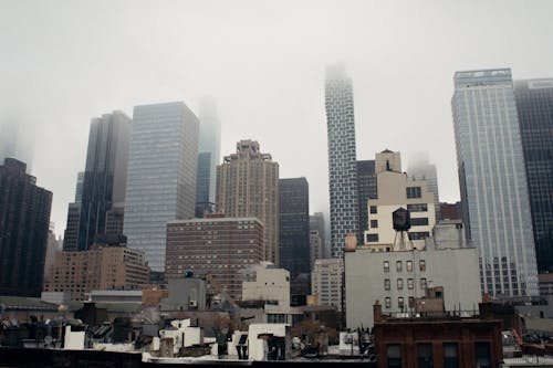 City Buildings During Foggy Fay