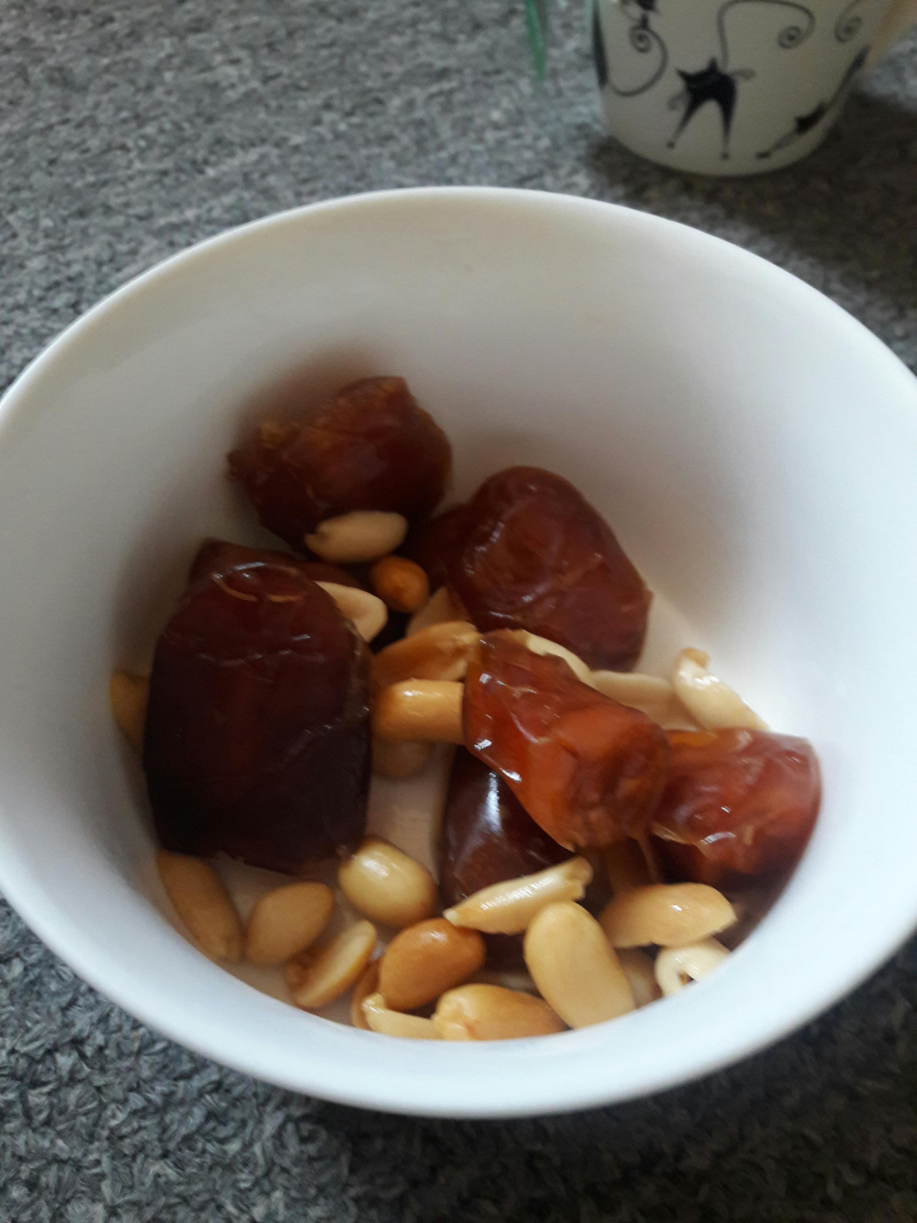 Elderly couple Eleanor and James laughing together at a park bench