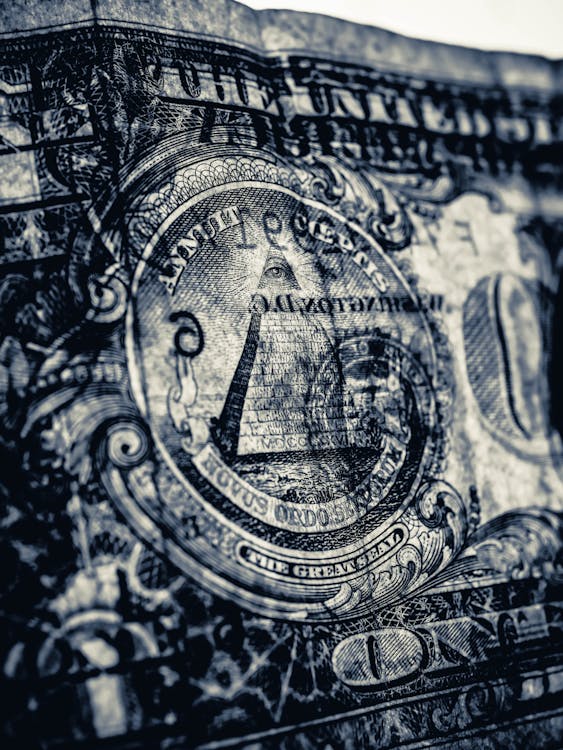 Close-up Shot of the Eye in the Dollar Paper Bill