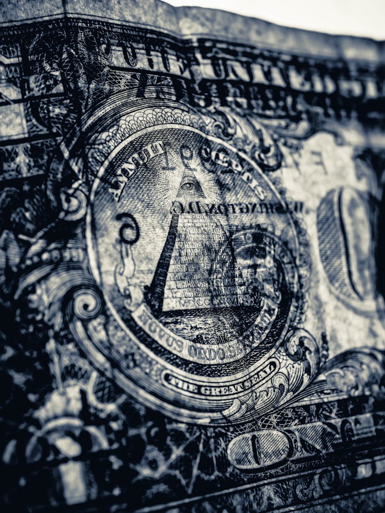 Close-up Shot Of The Eye In The Dollar Paper Bill