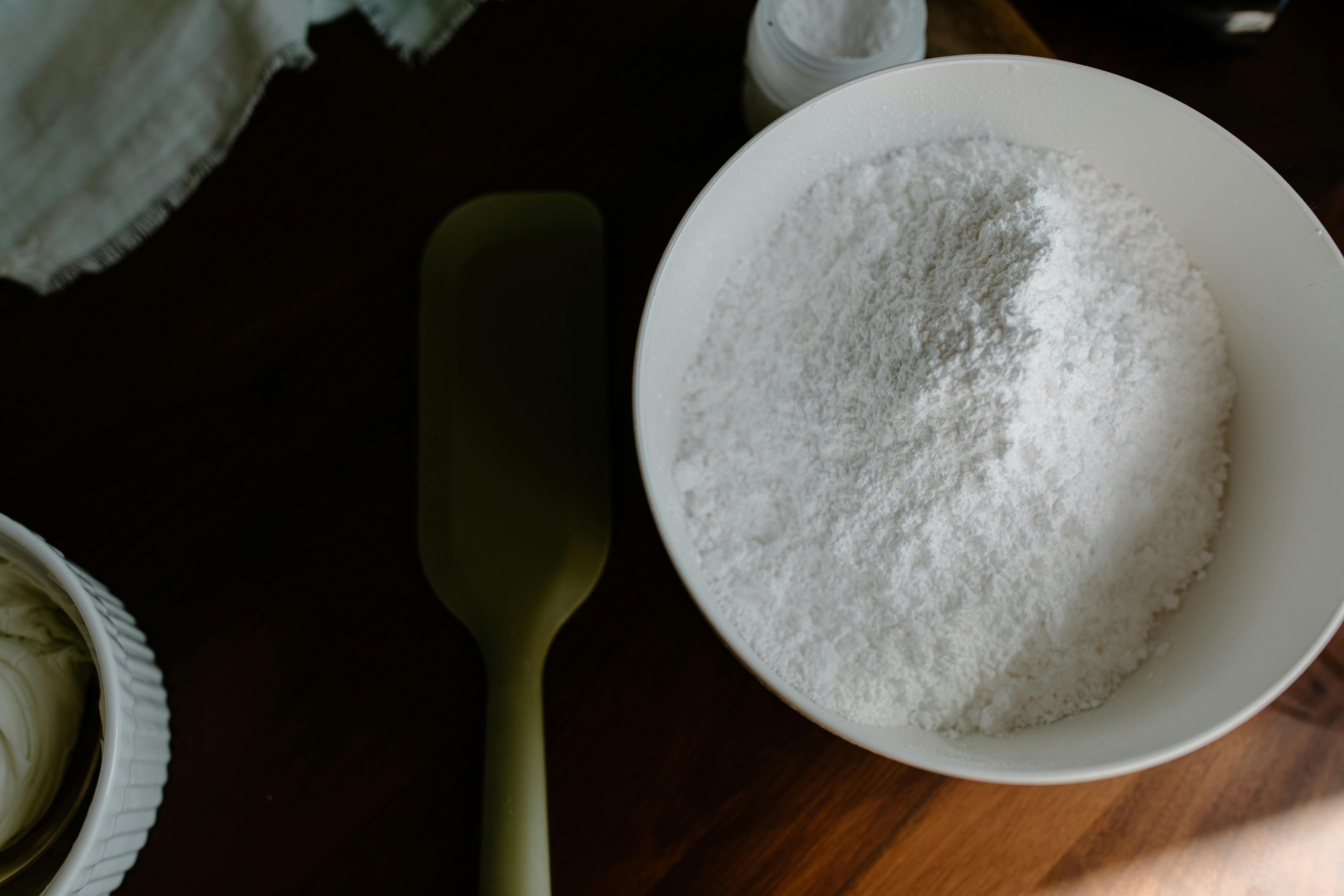 powder flour on white ceramic bowl