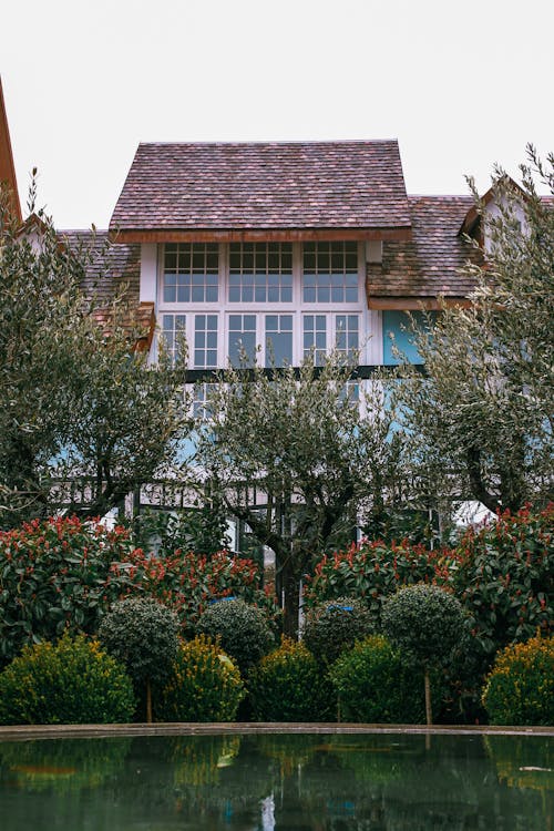 Facade of modern mansion in green park