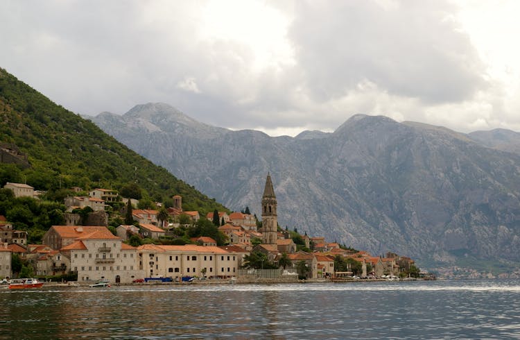 View Of Old Town At Lake In Mountains