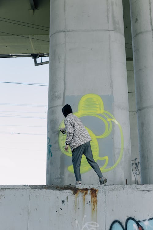 A Person Painting under the Bridge