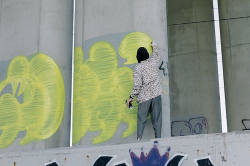 A Person Painting under the Bridge