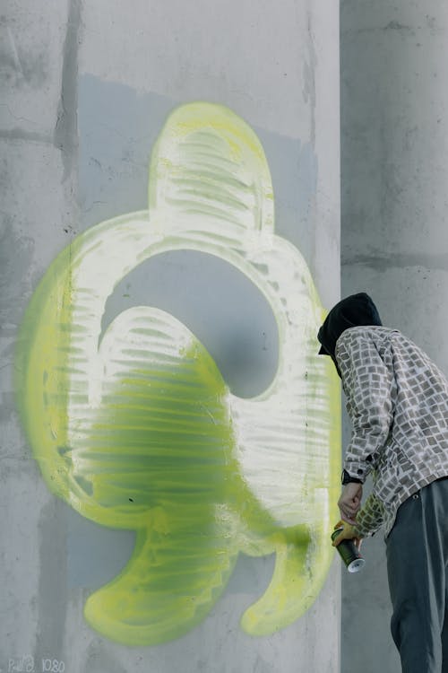 Person Holding a Spray Paint