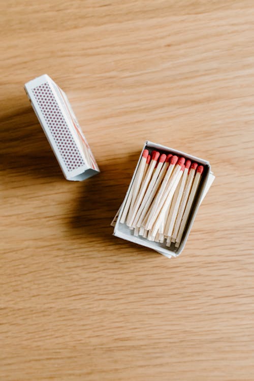 Free Match Sticks in a Box on Wooden Surface Stock Photo