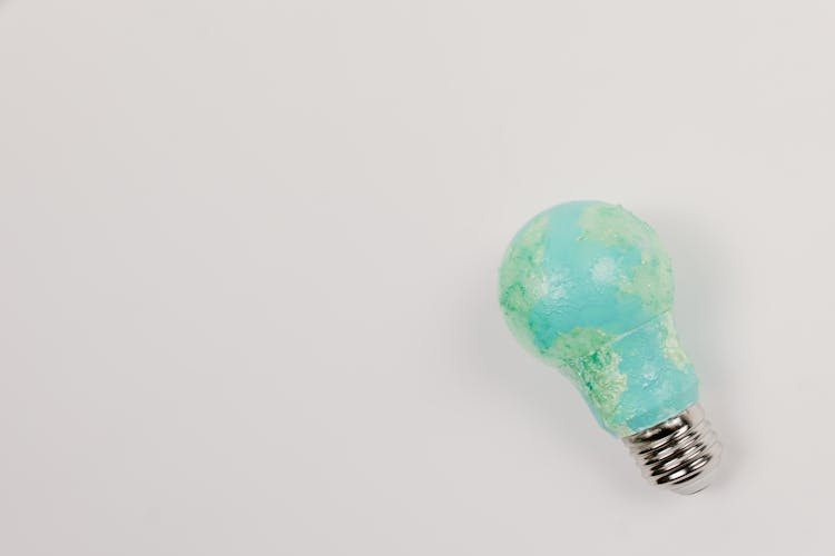 Light Bulb Painted With Teal And Paint