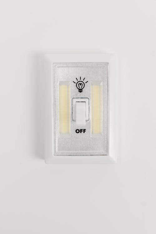 A White Light Switch on a White Wall