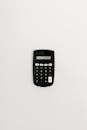 Black Calculator on White Table