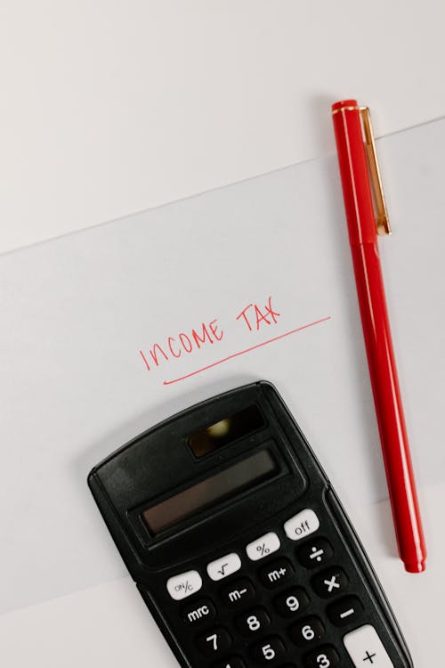 Free Black Calculator on the Table Stock Photo