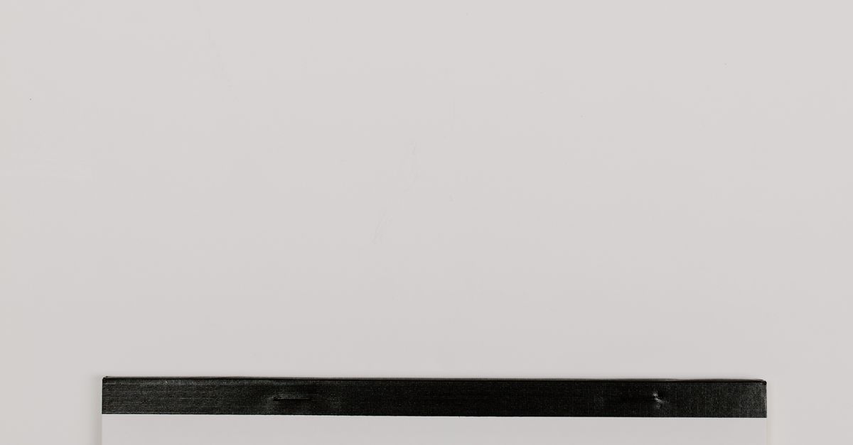 Photo by Tara Winstead Notepad with the word 'Taxes' on a white background, ideal for finance themes.