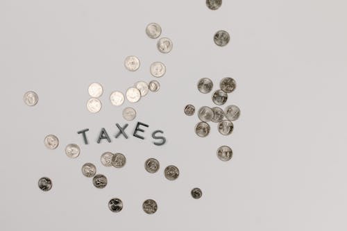 Ingyenes stockfotó adók, érmék, fehér felület témában