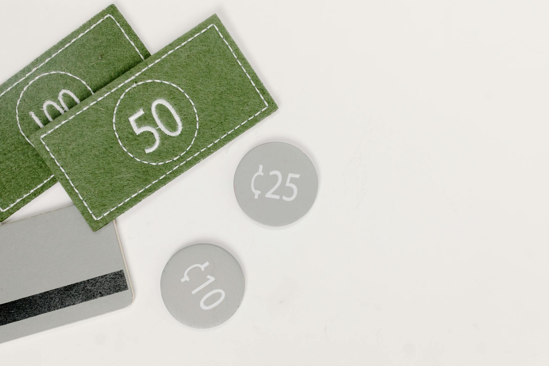 Conceptual image featuring fake currency and coins, emphasizing financial themes in neutral tones.